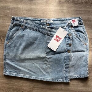 Brand New Celebrity Pink denim mini wrap skirt. Size XL.